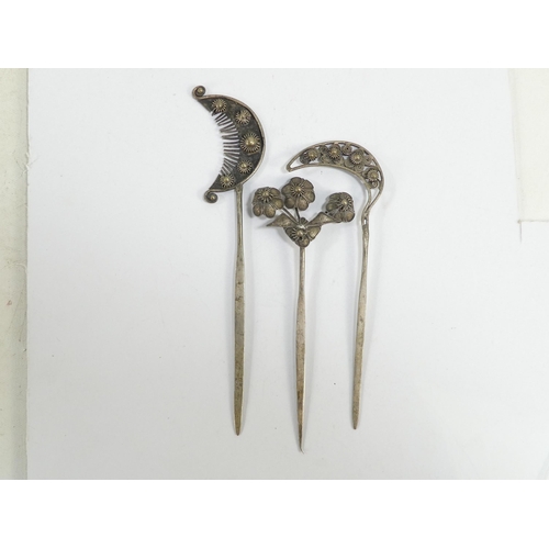 308 - Three various Chinese white metal hair pins - one modelled as blooming flowers, the other two as fol... 