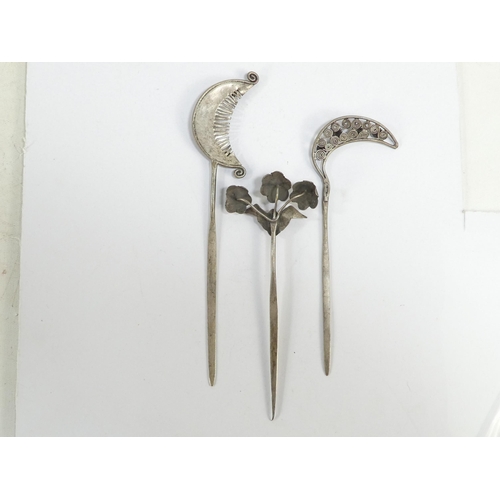 308 - Three various Chinese white metal hair pins - one modelled as blooming flowers, the other two as fol... 