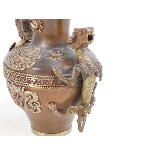 309 - A Chinese copper and brass vase - mounted with dragons and cabochon hardstones, 20cm high.