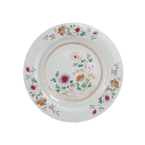 311 - A 19th century famille verte plate - decorated with chrysanthemums, 35cm diameter.