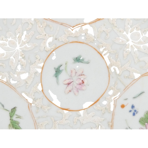 315 - A 19th century Chinese famille verte plate - decorated with floral vignettes on a white foliate grou... 