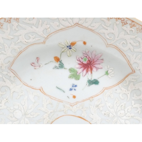 315 - A 19th century Chinese famille verte plate - decorated with floral vignettes on a white foliate grou... 