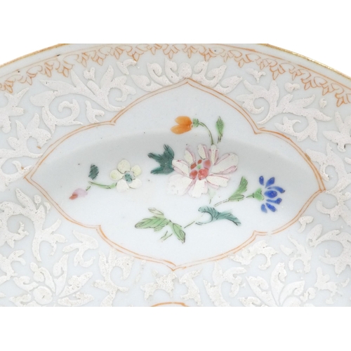 315 - A 19th century Chinese famille verte plate - decorated with floral vignettes on a white foliate grou... 