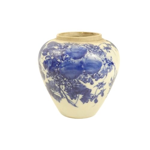 317 - A 19th century blue and white Chinese ginger jar - decorated with flowers and foliage, 12cm high.