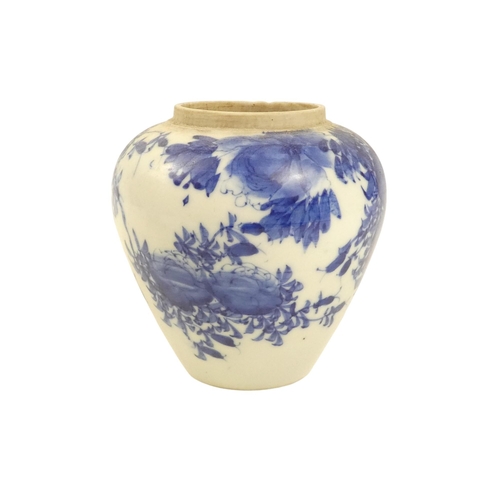 317 - A 19th century blue and white Chinese ginger jar - decorated with flowers and foliage, 12cm high.