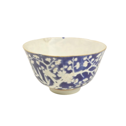 318 - An early 20th century Chinese blue and white rice bowl - with bamboo decoration and seal mark to bas... 