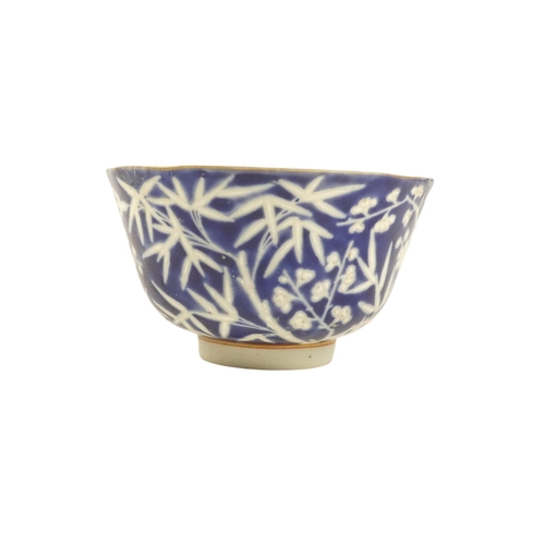 318 - An early 20th century Chinese blue and white rice bowl - with bamboo decoration and seal mark to bas... 