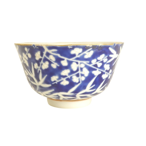 318 - An early 20th century Chinese blue and white rice bowl - with bamboo decoration and seal mark to bas... 