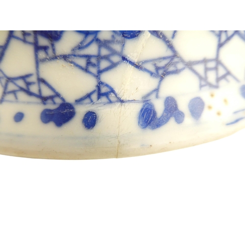 320 - A 19th century Chinese blue and white vase - of squat baluster form, decorated with berries on a web... 