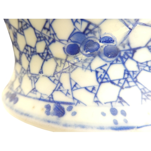 320 - A 19th century Chinese blue and white vase - of squat baluster form, decorated with berries on a web... 