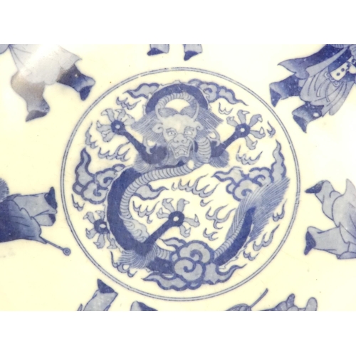 321 - A 19th century Chinese blue and white bowl - decorated with seven figures below wisteria, the centre... 