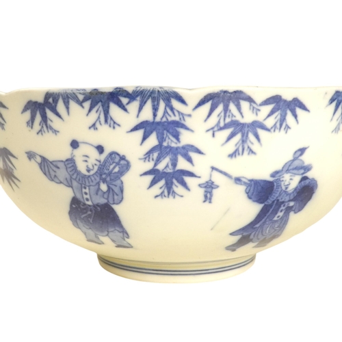 321 - A 19th century Chinese blue and white bowl - decorated with seven figures below wisteria, the centre... 