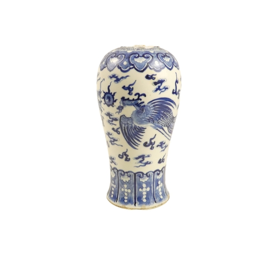 323 - A 19th century Chinese blue and white baluster shaped vase - decorated with a dragon and Fenghuang c... 