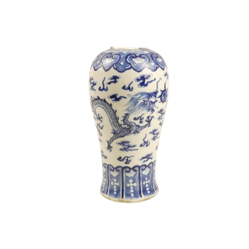 323 - A 19th century Chinese blue and white baluster shaped vase - decorated with a dragon and Fenghuang c... 