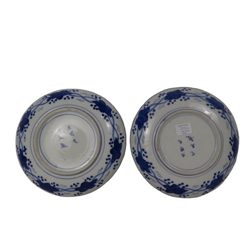 325 - A pair of early 20th century Chinese blue and white plates - decorated with dragons and a flaming pe... 