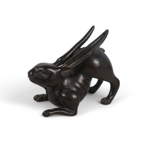 329 - A Japanese bronze rabbit - Meiji period (1865-1912) modelled in a squatting position with engraved f... 