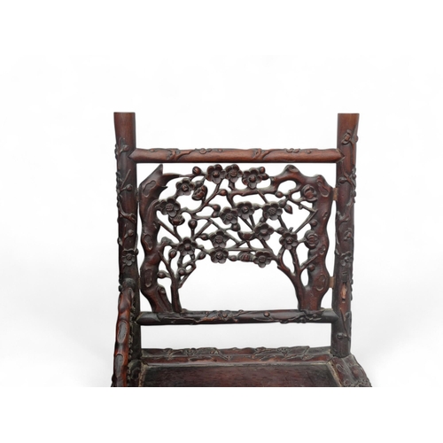 340 - An early 20th century oriental carved hardwood desk - of asymmetrical form incorporating pierced pan... 