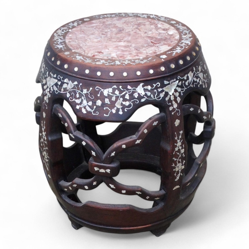 341 - A late 19th century Chinese hardwood barrel stool - with marble inset top with foliate mother-of-pea... 