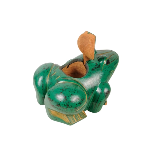 36 - An Indonesian green painted wooden frog - with gilt decoration and a hinged compartment to its back,... 