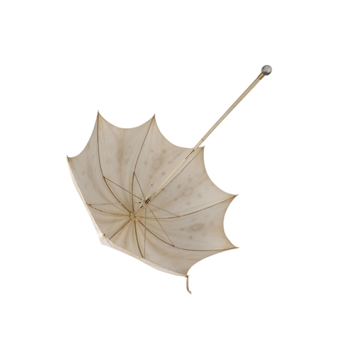 391 - An early 20th century white lace parasol - with a cut glass knop, 98cm.