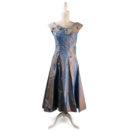 394 - A Brilkie Models evening dress - the iridescent blue fabric with flower, bead and sequin decoration,... 