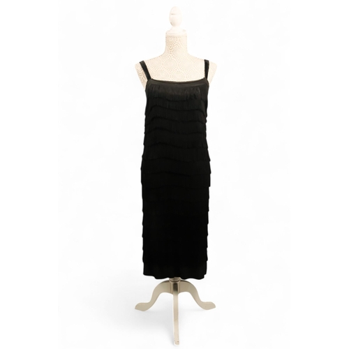 397 - A black 'Flapper' style dress - with black velvet straps, size 10/12, length 90cm.