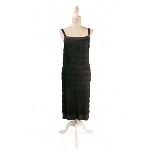 397 - A black 'Flapper' style dress - with black velvet straps, size 10/12, length 90cm.