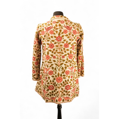 398 - A cream woollen coat - embroidered with flowers and birds, with cream silk lining, size 10/12, lengt... 