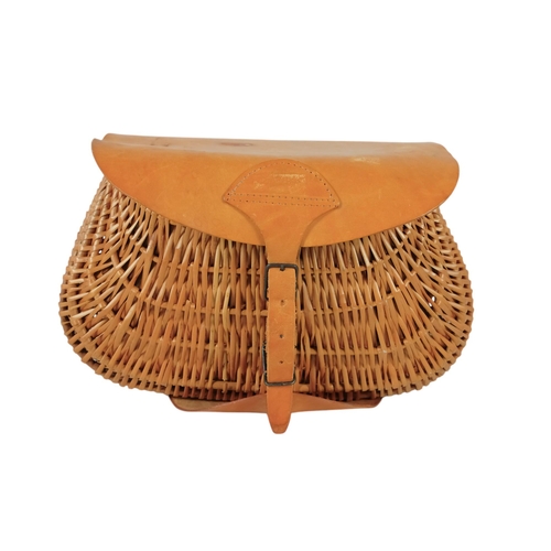 43 - A contemporary wicker fishing creel - with a tan leather cover and canvas pouch, 36cm wide, together... 