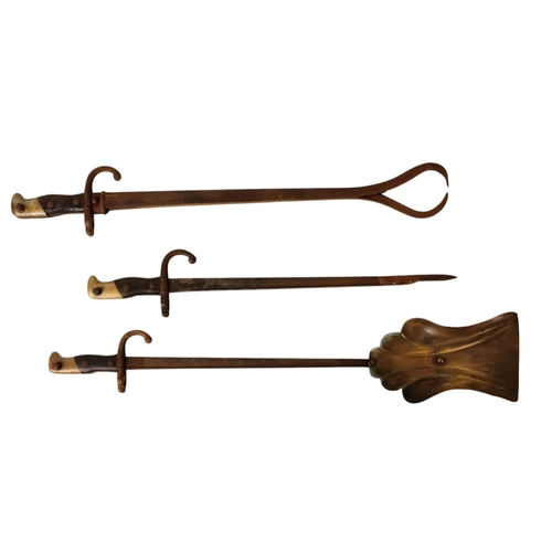 434 - A set of three 19th century fire tools - modelled from French bayonets, including a poker, a pair of... 