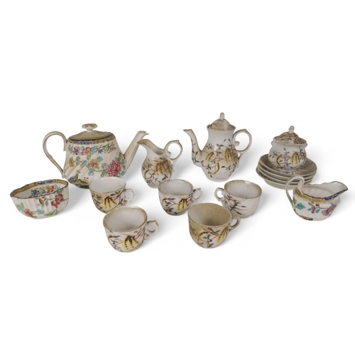 475 - An early 20th century dolls tea service - decorated with foliage on a white ground, comprising five ... 