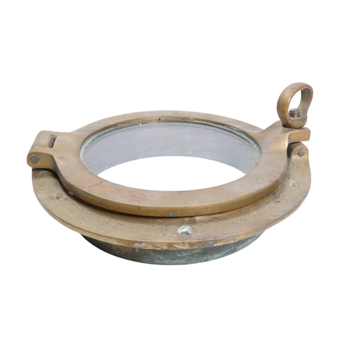 49 - A 20th century brass porthole - of typical form, just inner side, 23cm diameter, together with a bra... 