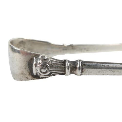 492 - A pair of Georgian silver sugar nips - together with another pair, 56g.