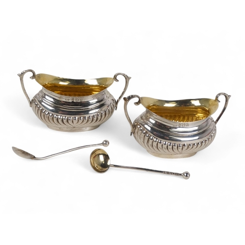 497 - A pair of silver salts - Brimingham 1902, twin handled and part gadrooned with a gilt lining, boxed ... 