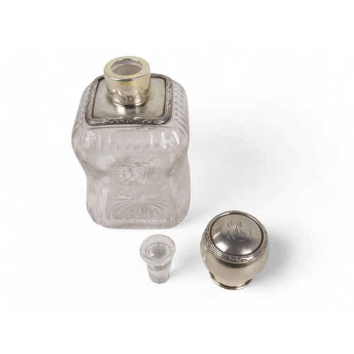 499 - A continental white metal mounted glass perfume bottle - square of a waisted form and etched with fl... 