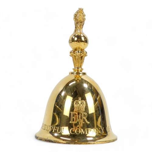 509 - A silver gilt table bell - London 1977, the knop modelled as a camel and engraved 'The Worshipful Co... 