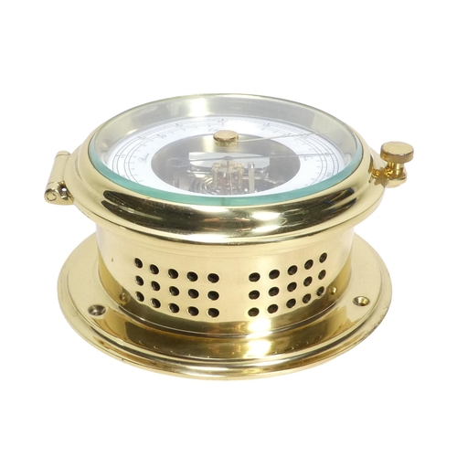 53 - A 20th century brass bulkhead aneroid barometer - with a white painted dial and exposed mechanism,18... 