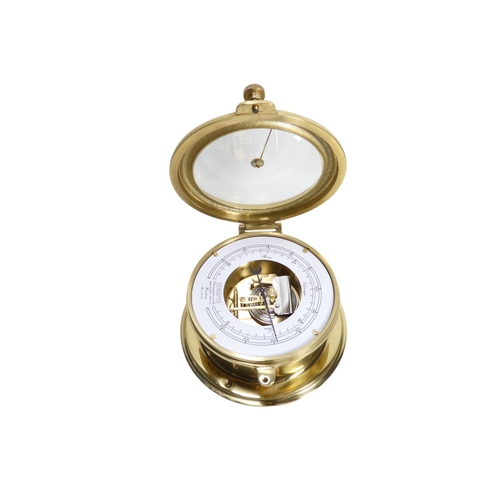 53 - A 20th century brass bulkhead aneroid barometer - with a white painted dial and exposed mechanism,18... 