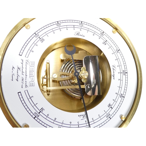 53 - A 20th century brass bulkhead aneroid barometer - with a white painted dial and exposed mechanism,18... 