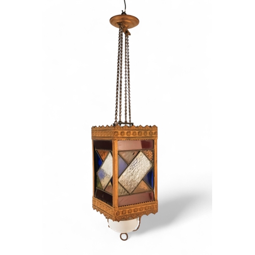 54 - A late 19th century hall lantern - square with stained glass panels and fitted with an oil lamp, 37c... 