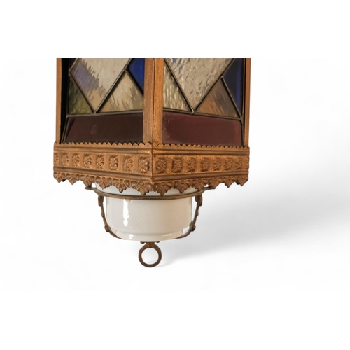 54 - A late 19th century hall lantern - square with stained glass panels and fitted with an oil lamp, 37c... 