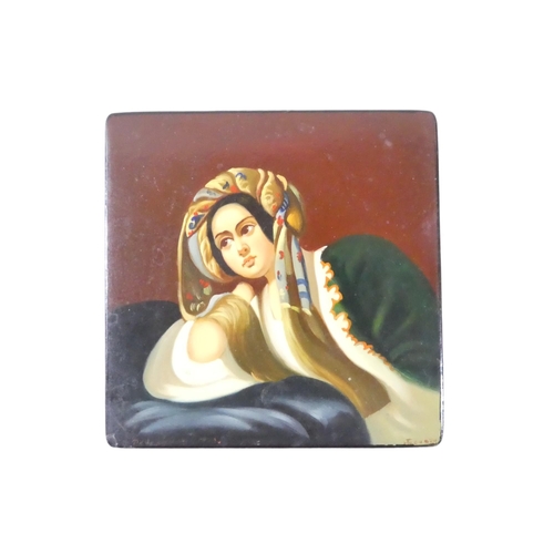 55 - A 20th century Russian papier mache box - the hinged cover decorated with a young woman, signed lowe... 