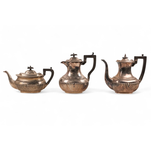 555 - A silverplated five piece tea service - part gadrooned with ebonised fittings, comprising teapot, co... 