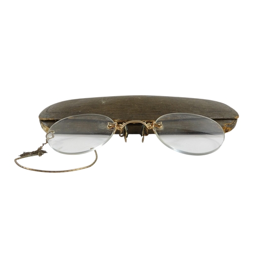 571 - A pair of early 20th century pince-nez - with gilt metal bridge (thought to be 14ct untested).