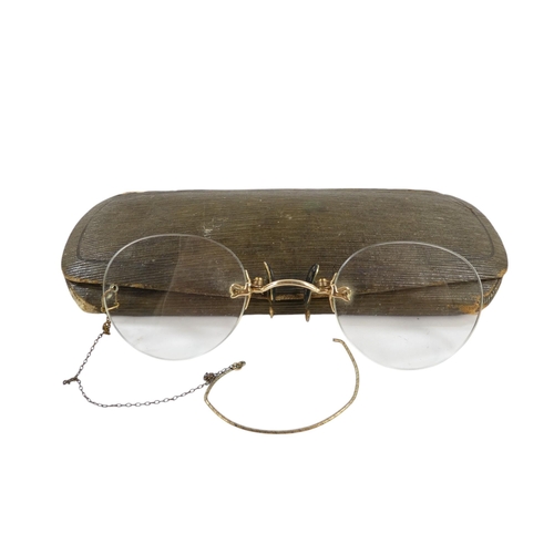 571 - A pair of early 20th century pince-nez - with gilt metal bridge (thought to be 14ct untested).