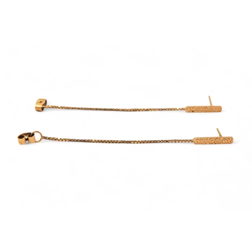 576 - A pair of 9ct gold charms - modelled as columns, together with three further charms, a pendant, a br... 