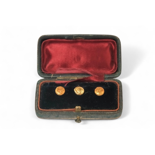 590 - A set of three 18ct gold shirt studs - with foliate decoration, 2.4g, boxed.