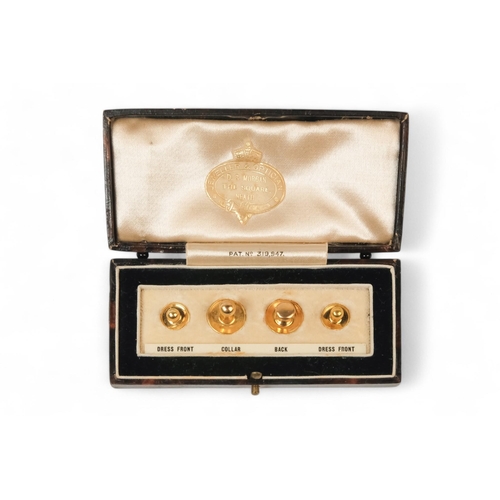 591 - A set of four 9ct gold shirt studs - in smart leather silk lined retail box for D.S. Morgan of Neath... 