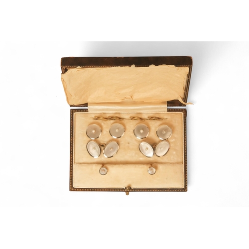 592 - A boxed set of 18ct gold shirt studs and cufflinks - mother-of-pearl and pearl set, 15.6g.