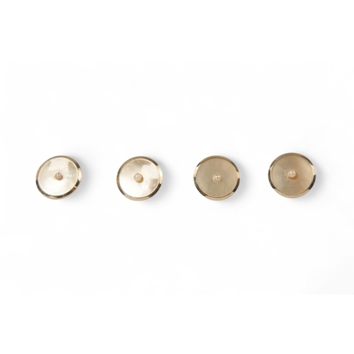 592 - A boxed set of 18ct gold shirt studs and cufflinks - mother-of-pearl and pearl set, 15.6g.